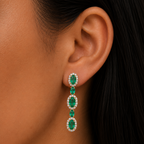 Aretes colgantes de esmeraldas con halo de diamantes
